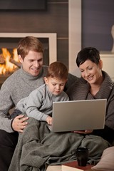 Happy family with computer