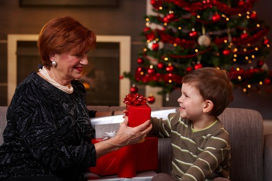 Little boy giving surprise at christmas
