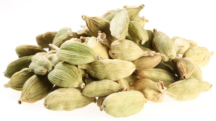 Cardamom seeds on a white background