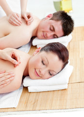 Fototapeta na wymiar Relaxed caucasian couple receiving a back massage