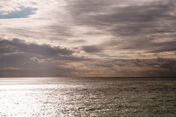 Calm water, threatening sky
