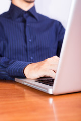 Businessman Typing on Computer Keyboard