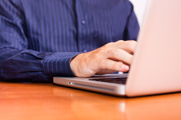 Businessman Typing on Computer Keyboard