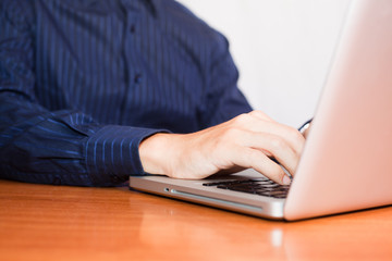 Businessman Typing on Computer Keyboard