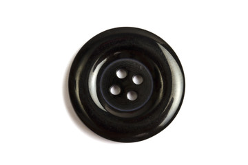 Black clothing button isolated on white