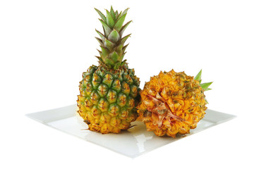 pineapples and slices on white