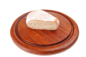 cheese on wooden plate
