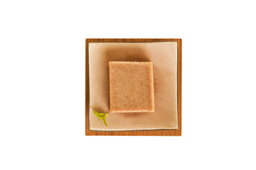 Organic soap bar on white background.