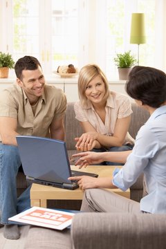 Young couple with estate agent.