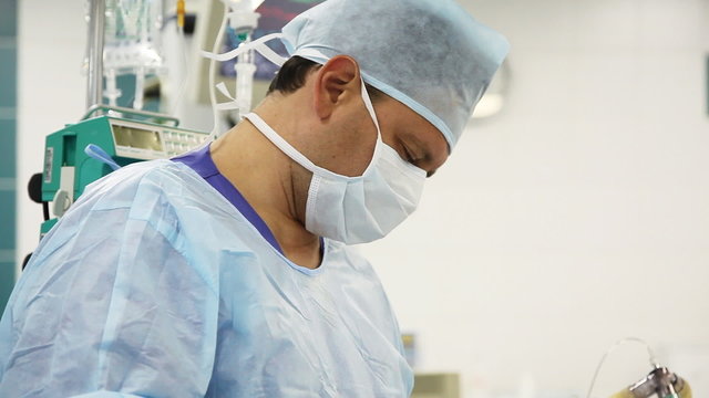 male surgeon with works in operation room