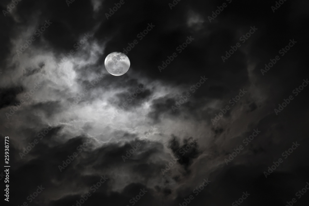 Wall mural Spooky full moon and eerie white clouds