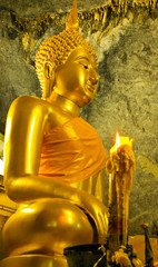 seated buddha in cave temple thailand