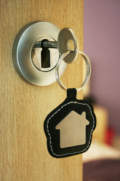 A key in a lock with house icon on it