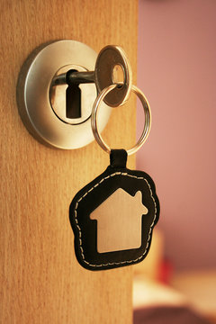 A key in a lock with house icon on it