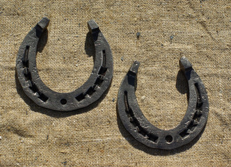 Two horseshoes on sacking