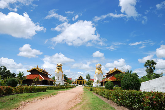 Walk way of buddhist temple with brighten sky