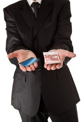Business man holding money and credit card on white isolated bac