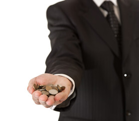 Male hand in suit holding coins on white isolated background