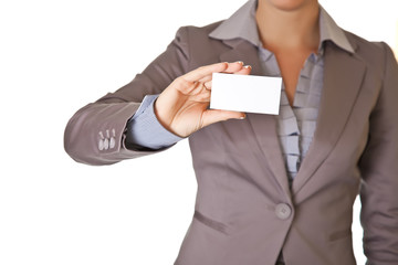 Caucasian blond woman holding blank business card wearing busine