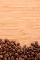 Coffee beans on brown background