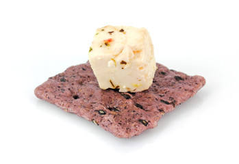 Rice cracker with feta cheese on top
