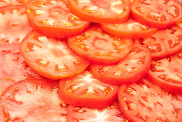 Pattern of red sliced tomatoes