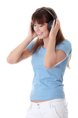 Happy teen girl listening to the music