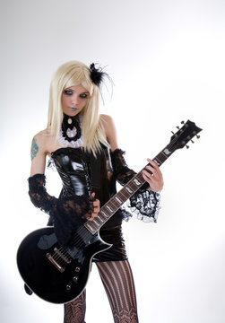 Sexy gothic girl with guitar