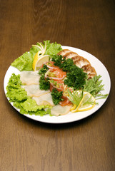 Appetizer made of meat and fish served
