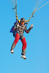 The young parachutist in air - obrazy, fototapety, plakaty