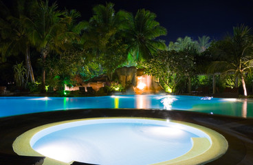 Pool and waterfall at night