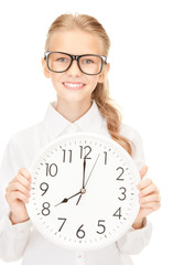 girl holding big clock