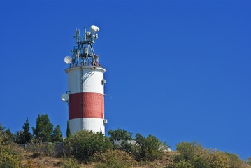 beautiful lighthouse on a blue sky background