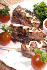Fried meat served with tomato sauce and salad