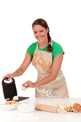 Woman baking Belgium waffles