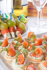Snacks with salmon and cheese for wine