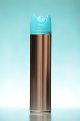 Silver freshener over blue background