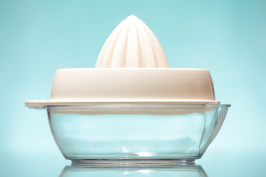 Transparent squeezer over blue background