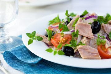 Delicious tuna salad with olives and fresh herbs