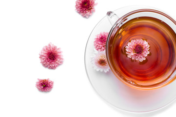 cup of herbal tea with pink flowers