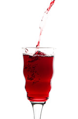 red wine pouring into glass