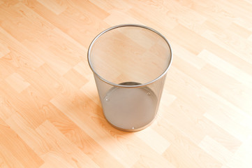 Garbage bin with paper waste isolated on white