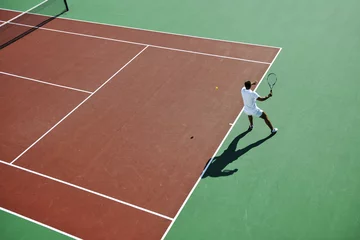 Rolgordijnen young woman play tennis © .shock