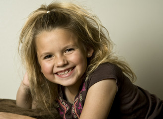 Adorable little girl smiling at the viewer