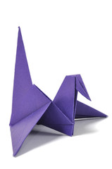Origami crane over white
