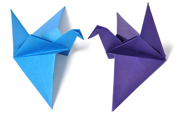 Origami cranes over white