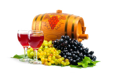Arrangement of grapes with a wine barrel of wine and glasses