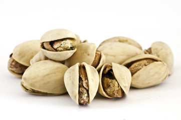 Salty nuts of roasted pistachio on isolated background