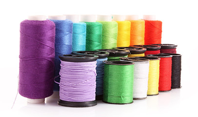 Few bobbins isolated on white