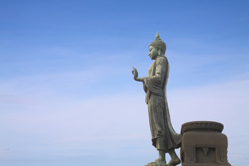 Walking Buddha statue